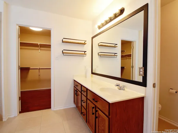 a bathroom with a sink and mirror