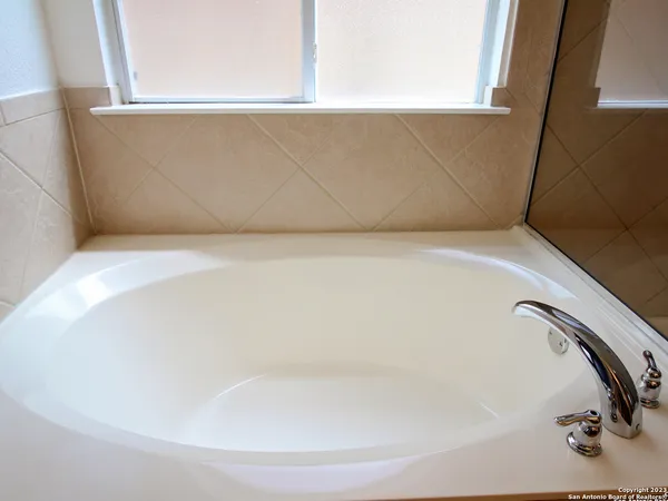 a close view of a bathtub in a bathroom