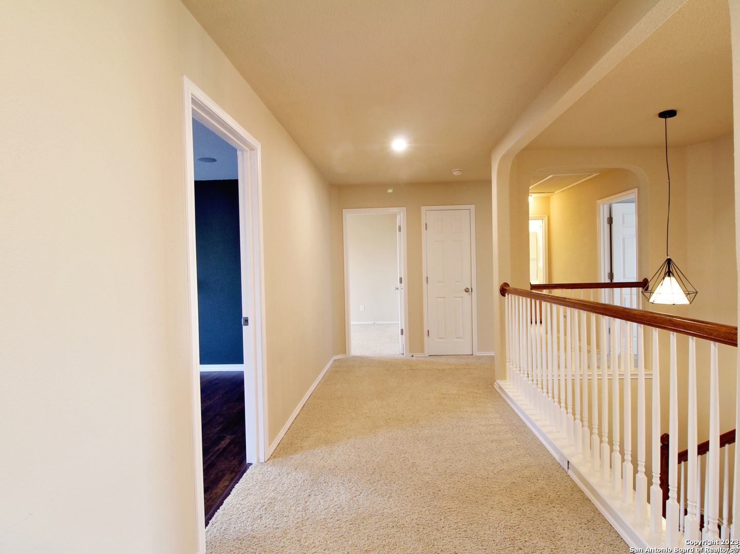 9627 Mediator Run Converse, TX 78109 - Photo 25 of 41 a view of a hallway with wooden floor