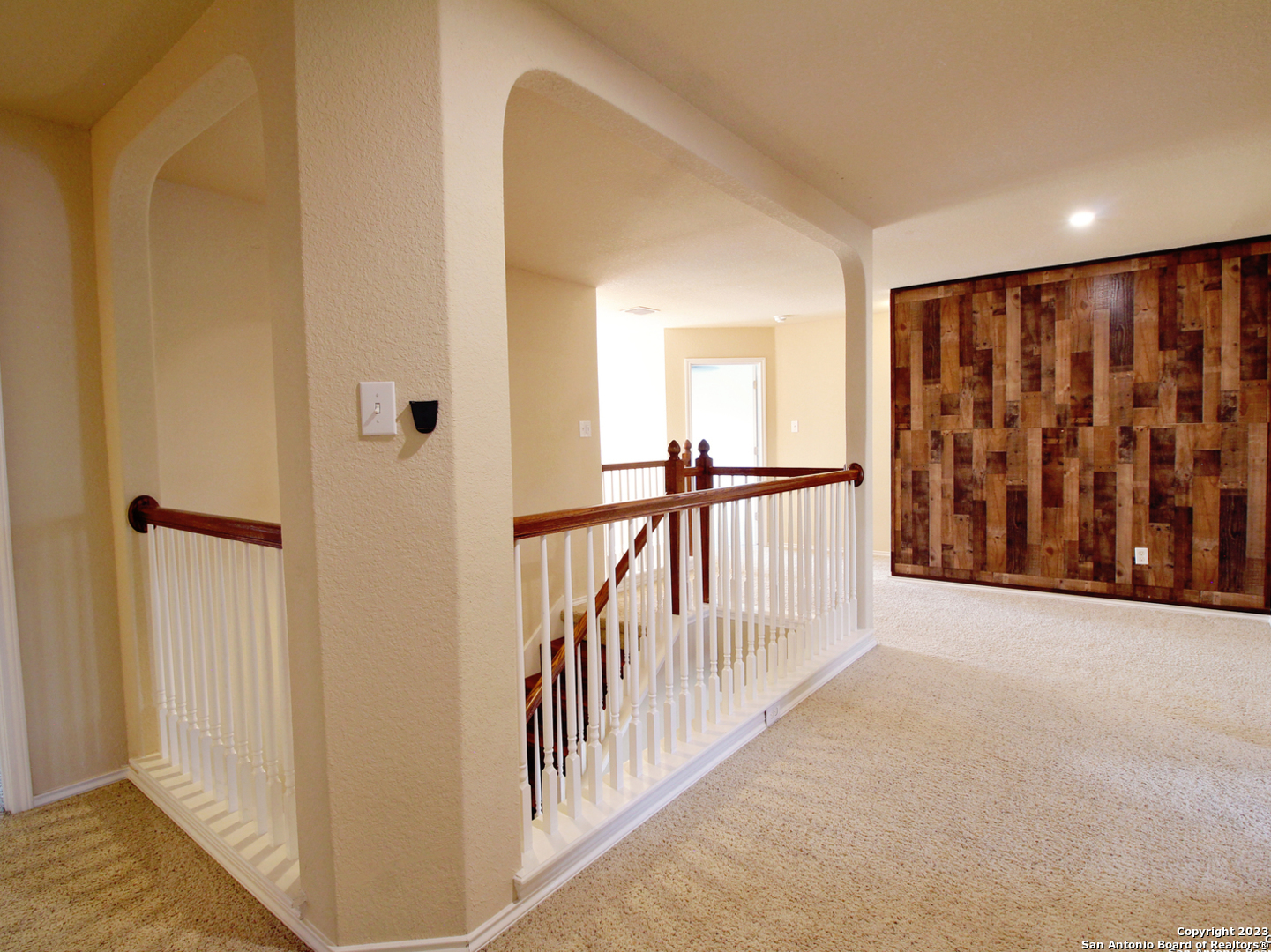 9627 Mediator Run Converse, TX 78109 - Photo 28 of 41 a view of a hallway with wooden floor and entryway