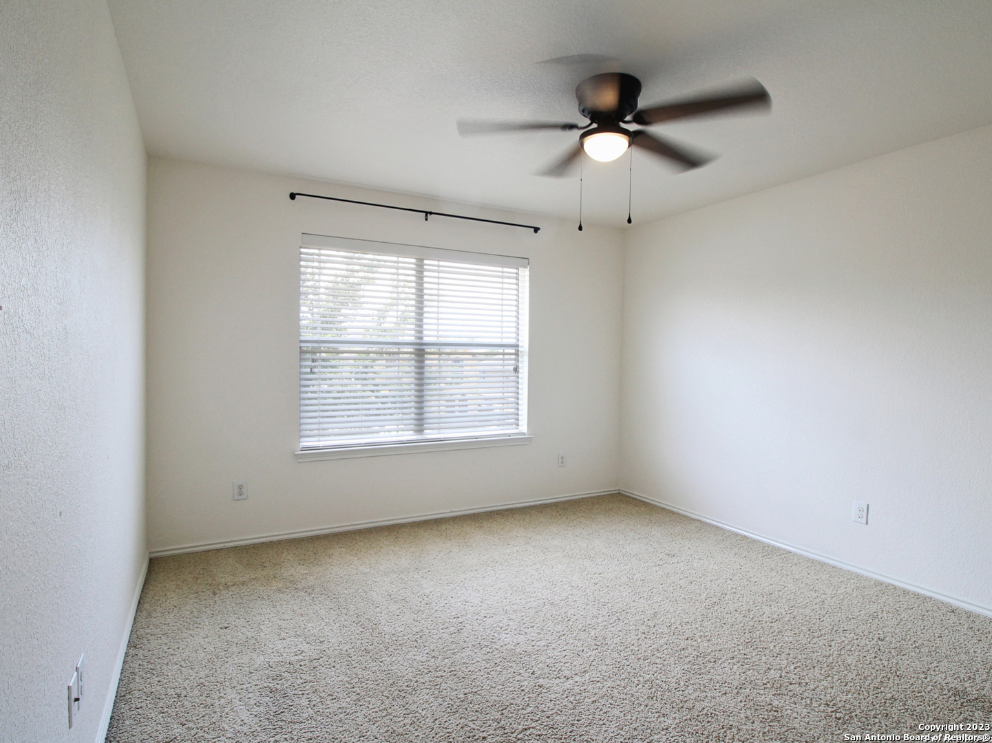 9627 Mediator Run Converse, TX 78109 - Photo 34 of 41 an empty room with a ceiling fan and window