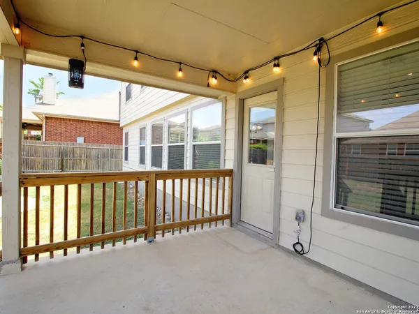 a view of a porch with wooden floor