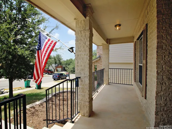 a view of a balcony with a tree