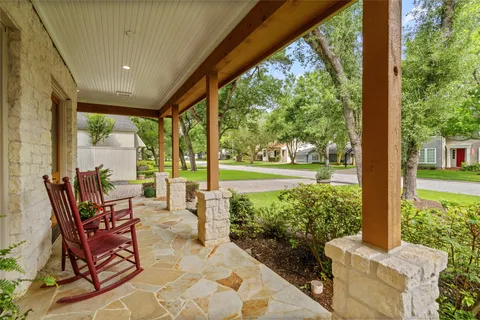 a building outdoor space with patio furniture and garden