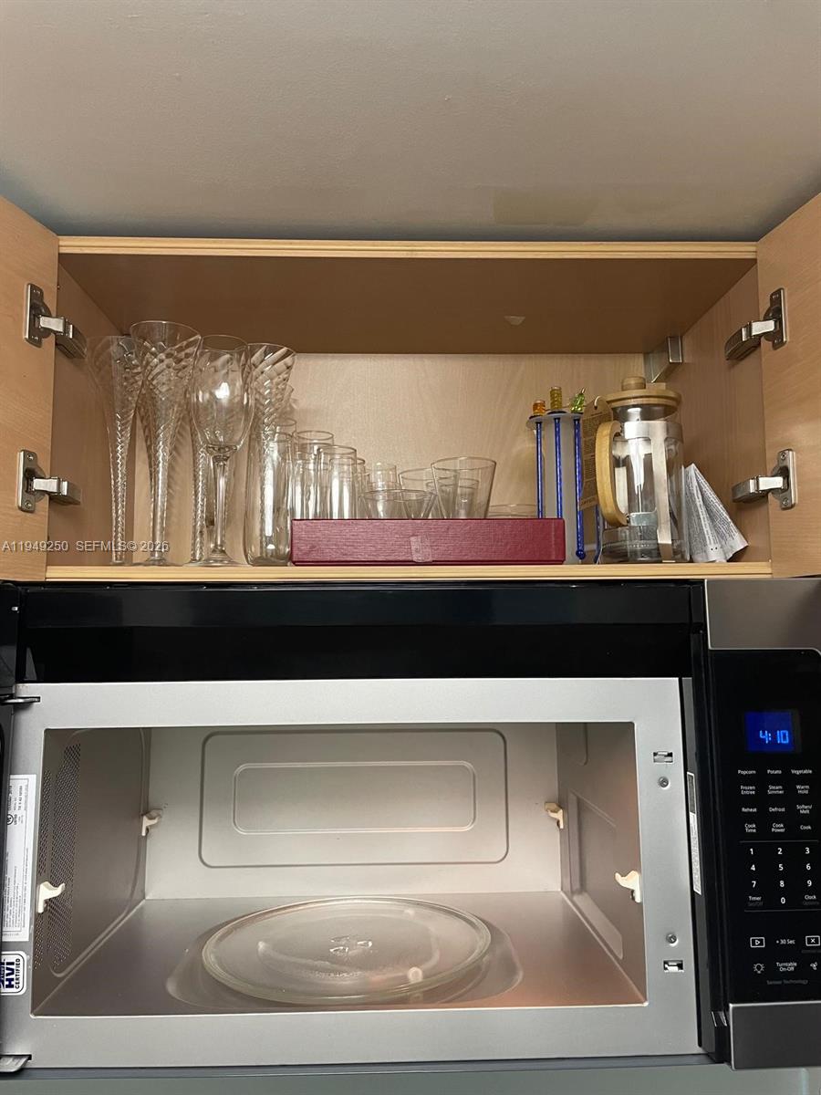 2101 Brickell Avenue, Unit 2110 Miami, FL 33129 - Photo 13 of 15 a bathroom with a sink and a mirror