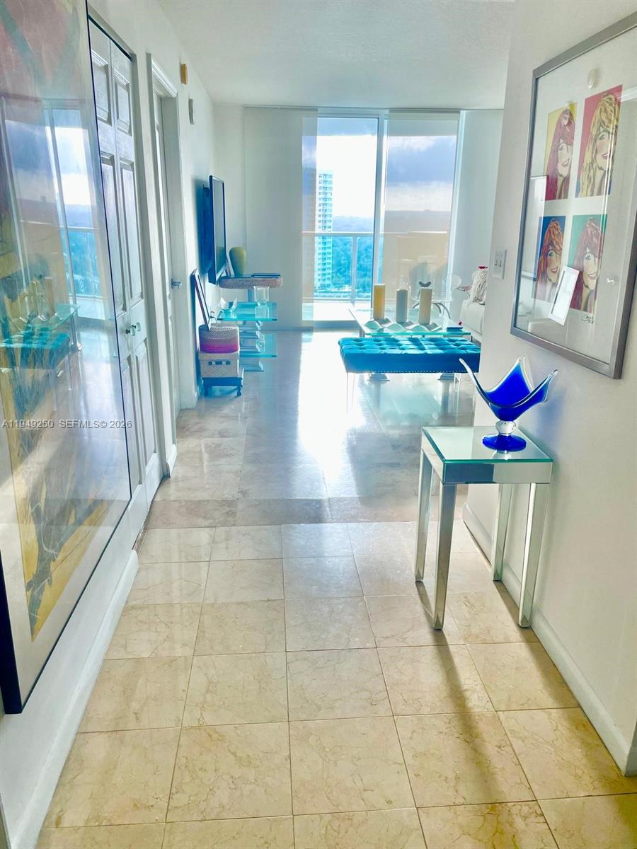 2101 Brickell Avenue, Unit 2110 Miami, FL 33129 - Photo 5 of 15 a lobby with furniture and a rug