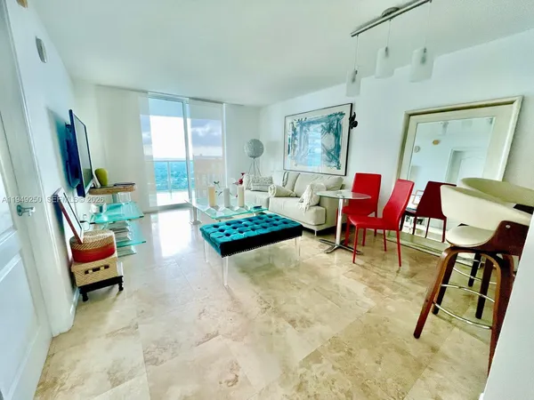 a living room with furniture and a table