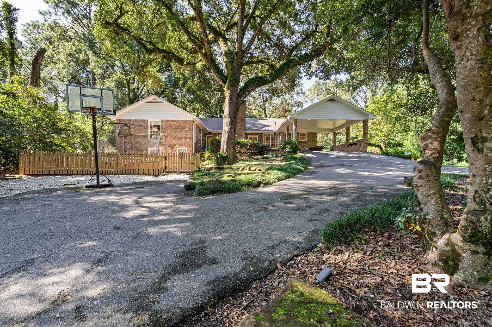 3612 Linden Lane Mobile, AL 36608 - Photo 40 of 42 View of front of house featuring brick siding and asphalt driveway