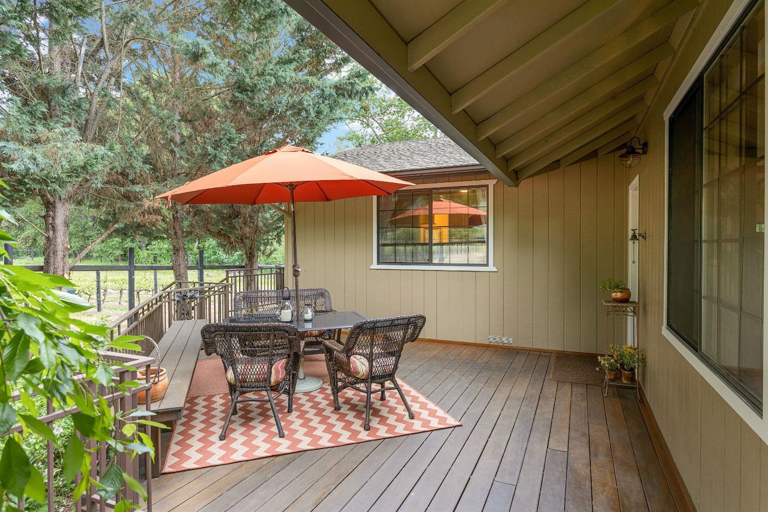 9155 North Applegate Road Grants Pass, OR 97527 - Photo 28 of 35 a view of backyard with outdoor seating and wooden floor