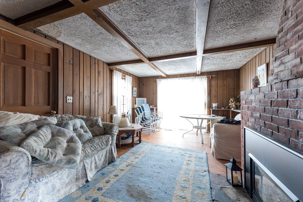 13 Wianno Road Marion, MA 02738 - Photo 21 of 25 a living room with furniture and a large window