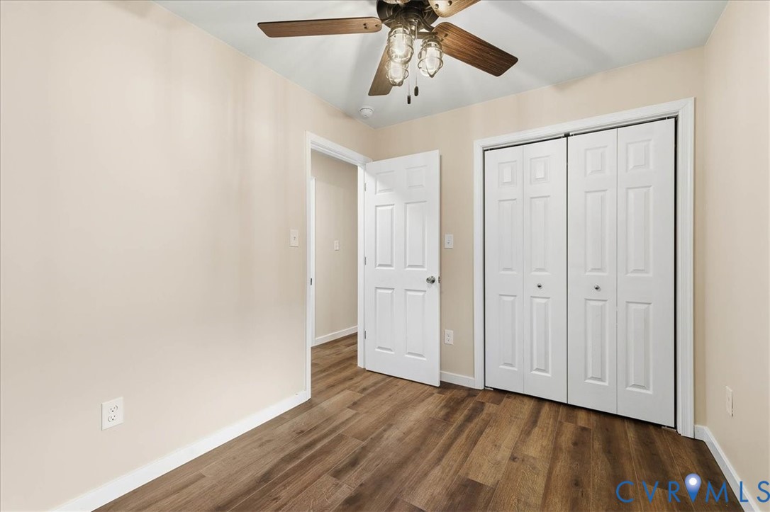 7603 Golf Course Drive Disputanta, VA 23842 - Photo 12 of 24 a view of empty room with wooden floor