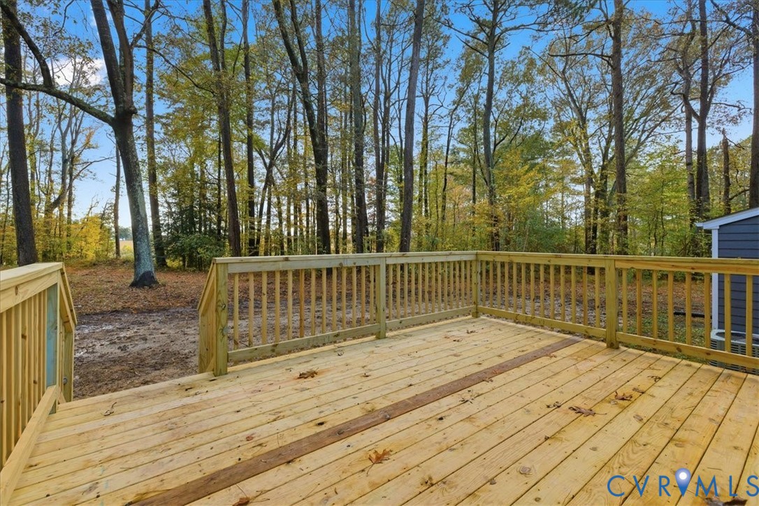7603 Golf Course Drive Disputanta, VA 23842 - Photo 14 of 24 a view of balcony with wooden floor and fence