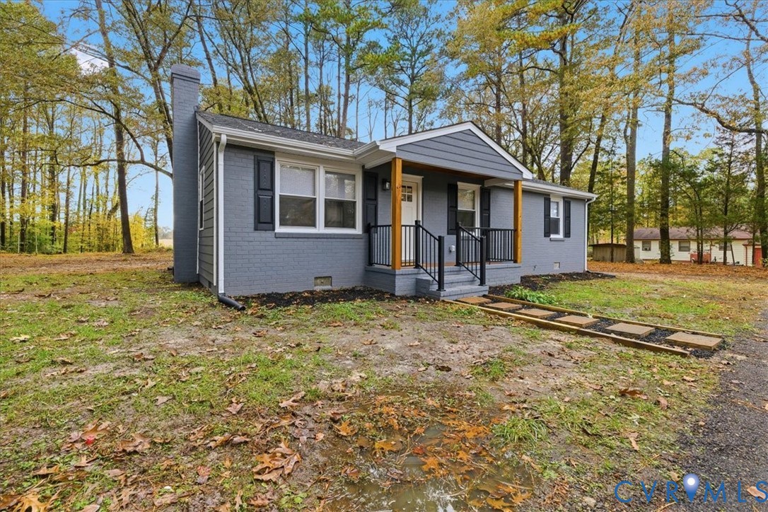 7603 Golf Course Drive Disputanta, VA 23842 - Photo 2 of 24 front view of a house with a yard
