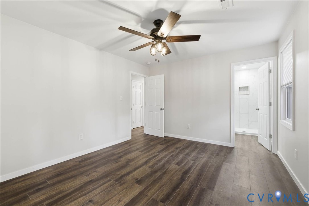 7603 Golf Course Drive Disputanta, VA 23842 - Photo 21 of 24 a view of an empty room with wooden floor