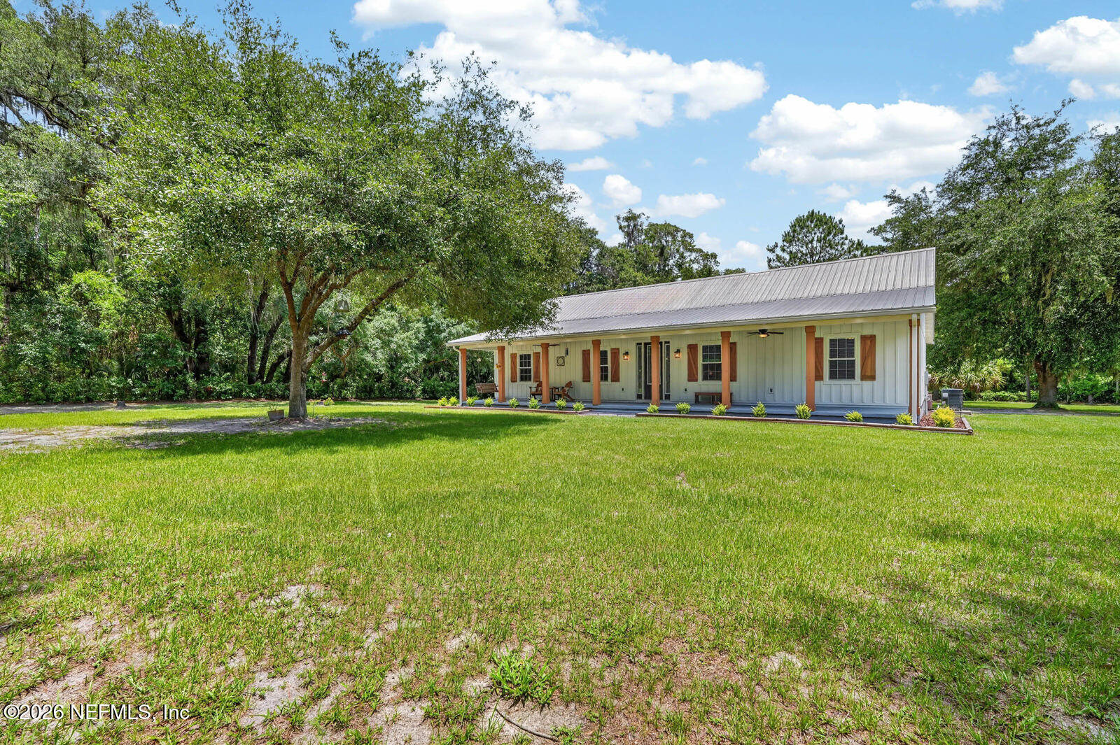 264 Peniel Church Road Palatka, FL 32177 - Photo 4 of 48 a view of house with a big yard and large trees