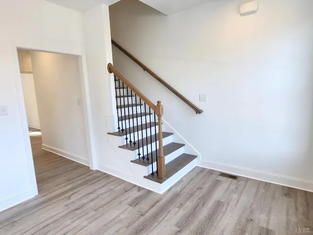 a view of entryway with wooden floor