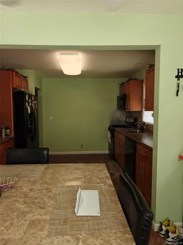 a kitchen with a sink a stove and cabinets