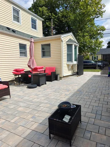 a view of a white house with a yard