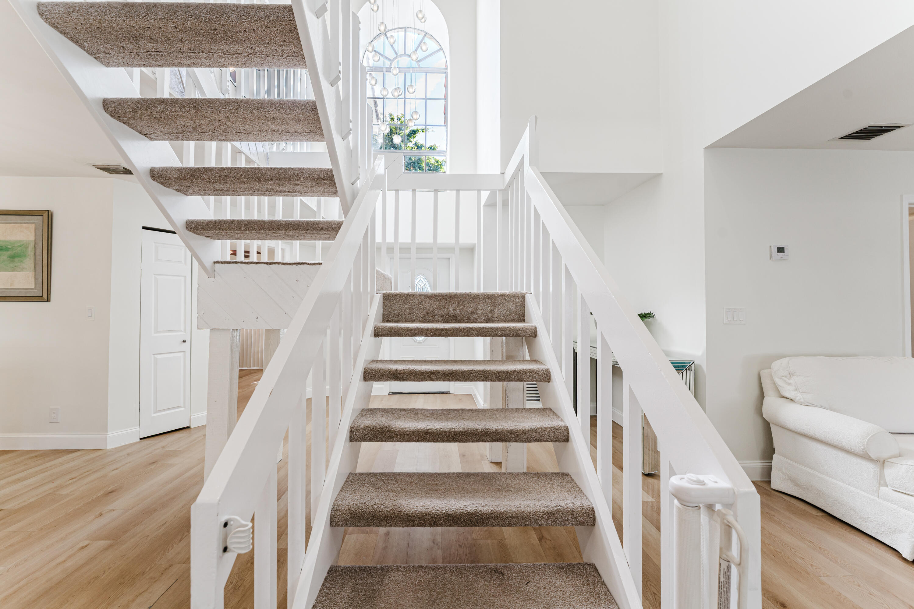 665 Jeffery Street Boca Raton, FL 33487 - Photo 21 of 44 a view of entryway and hall with wooden floor
