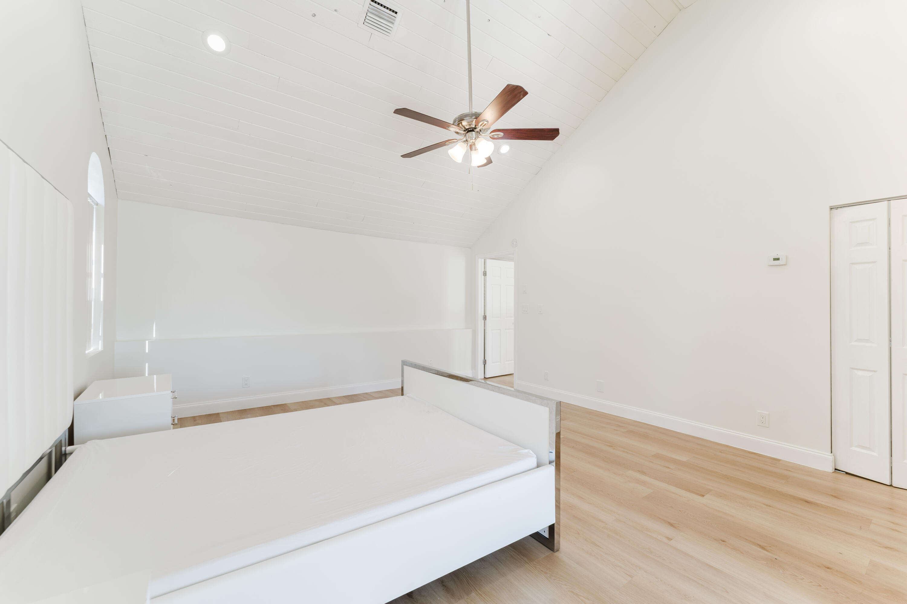 665 Jeffery Street Boca Raton, FL 33487 - Photo 30 of 44 a hallway with a white bed