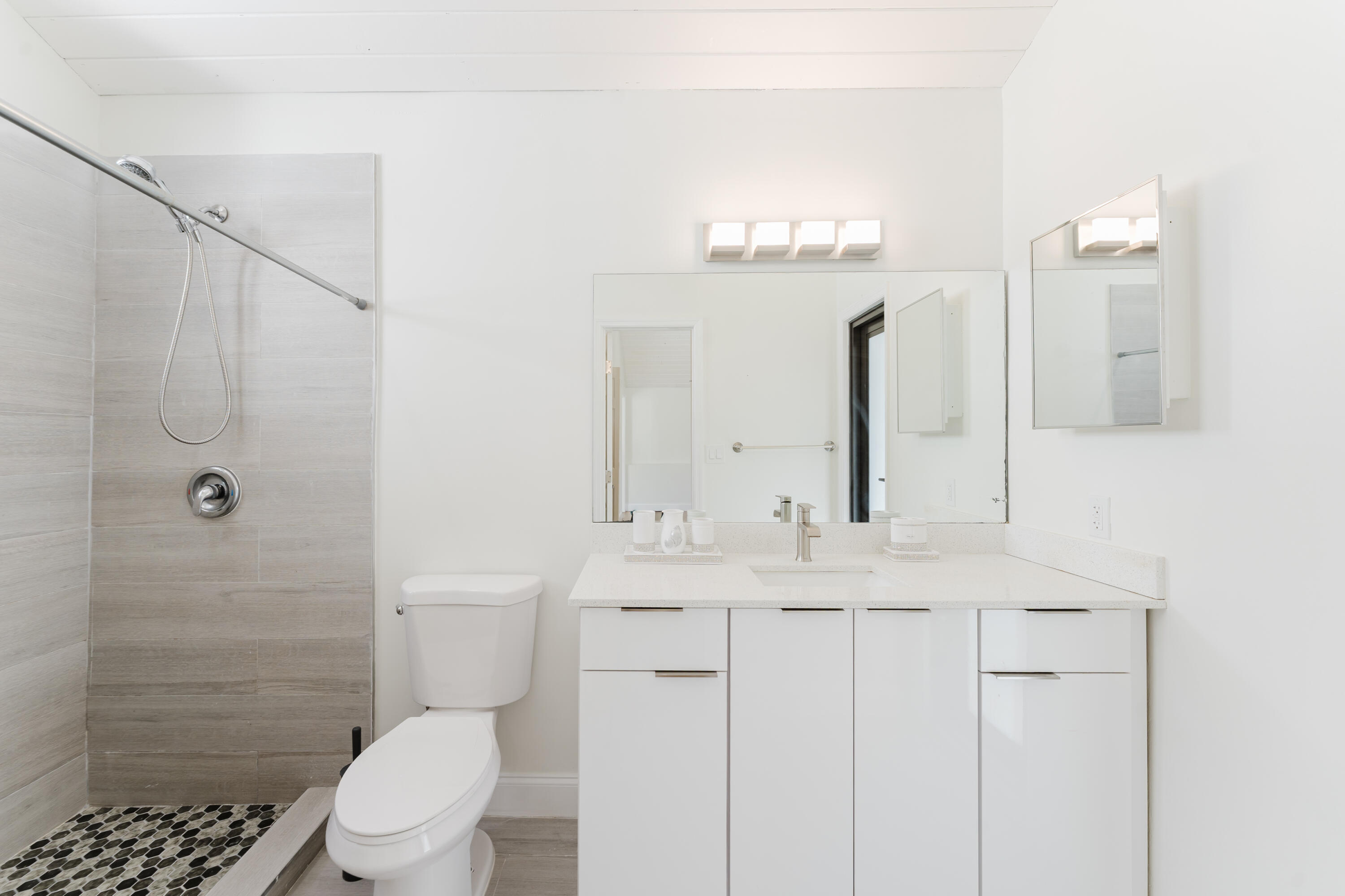 665 Jeffery Street Boca Raton, FL 33487 - Photo 34 of 44 a bathroom with a sink a toilet and shower