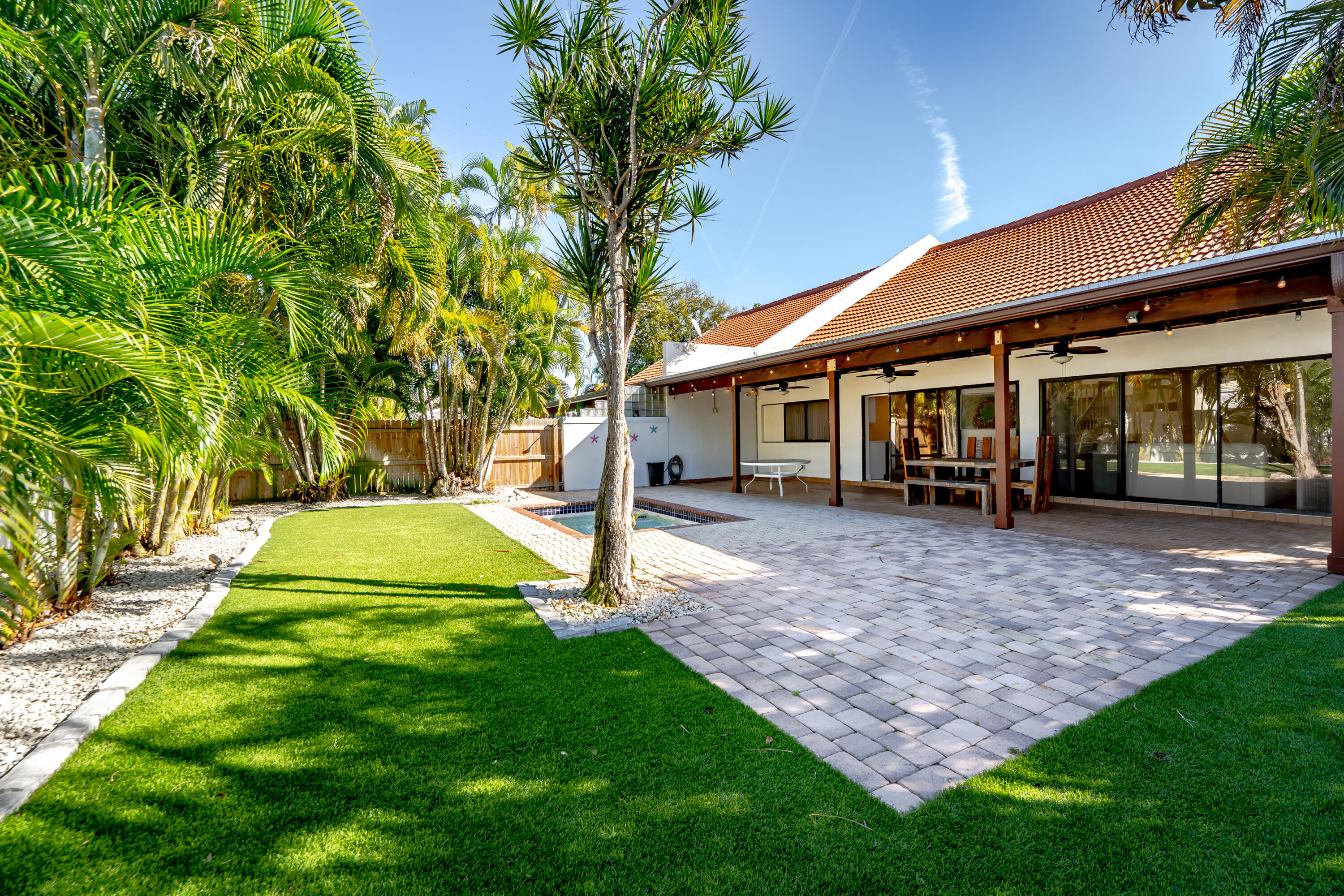 665 Jeffery Street Boca Raton, FL 33487 - Photo 42 of 44 a view of a house with a backyard