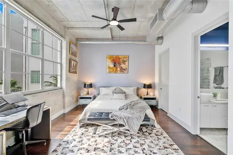 a living room with furniture and a rug