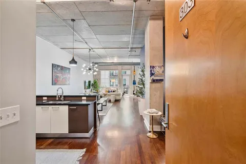 a kitchen with a sink and appliances