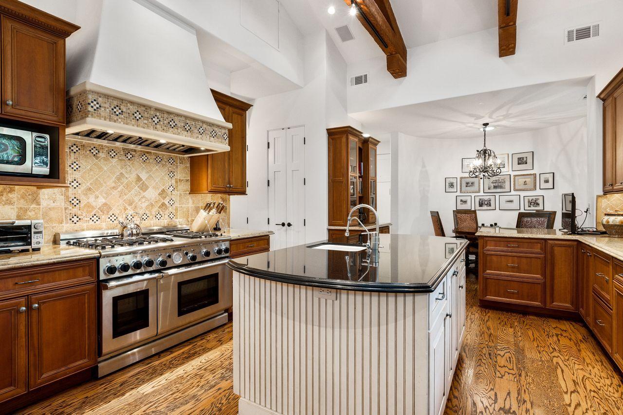 492 Monarch Lane Montecito, CA 93108 - Photo 14 of 58 a kitchen with stainless steel appliances granite countertop a stove and a sink