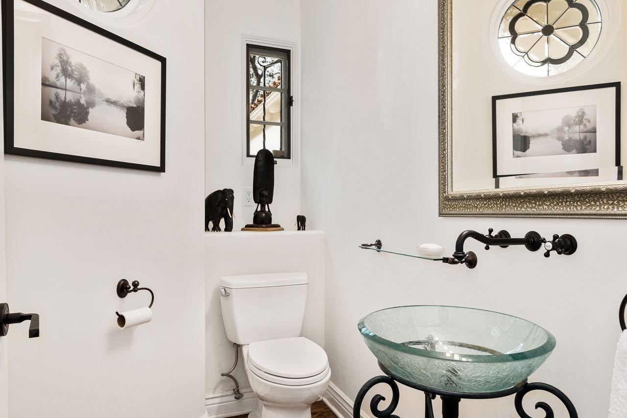 492 Monarch Lane Montecito, CA 93108 - Photo 18 of 58 a bathroom with a toilet a sink and a mirror