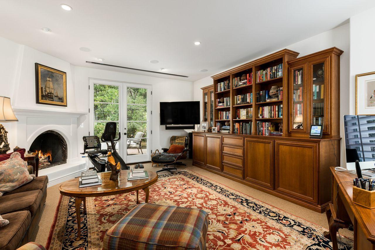 492 Monarch Lane Montecito, CA 93108 - Photo 21 of 58 a living room with furniture a rug and a fireplace