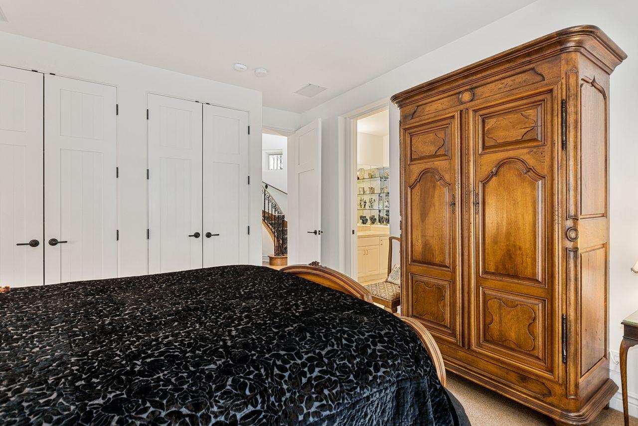 492 Monarch Lane Montecito, CA 93108 - Photo 26 of 58 a bedroom with a bed and a closet