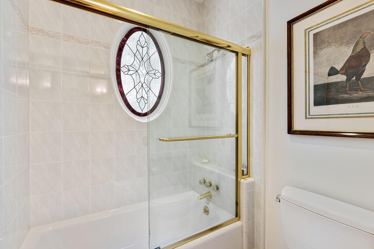 492 Monarch Lane Montecito, CA 93108 - Photo 28 of 58 a bathroom with a large mirror a shower and a bathtub