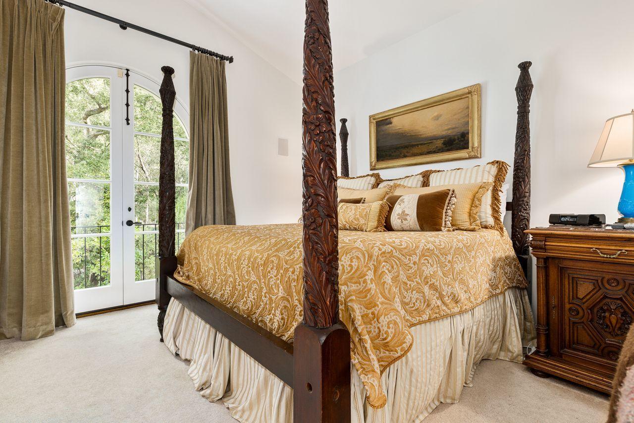 492 Monarch Lane Montecito, CA 93108 - Photo 32 of 58 a bedroom with a bed and flat screen tv