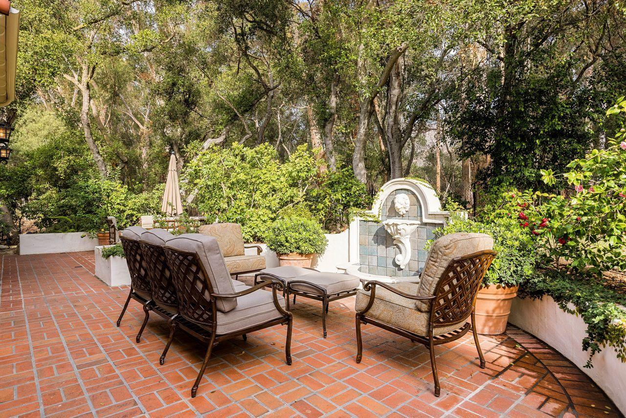 492 Monarch Lane Montecito, CA 93108 - Photo 37 of 58 a view of a chairs and tables in the backyard
