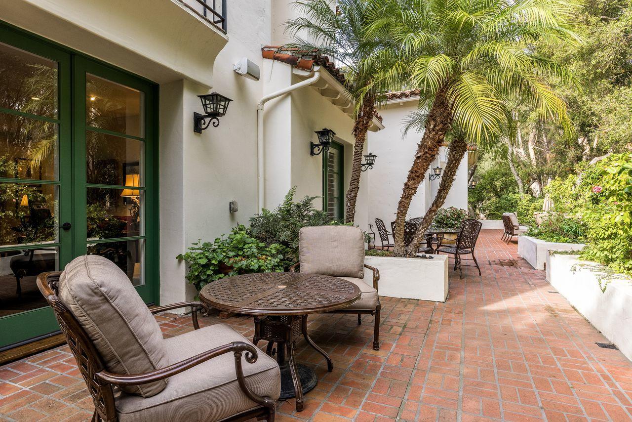 492 Monarch Lane Montecito, CA 93108 - Photo 39 of 58 a view of a patio with table and chairs and potted plants