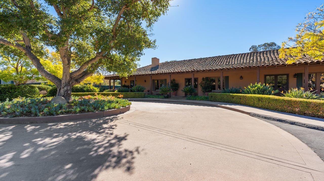 492 Monarch Lane Montecito, CA 93108 - Photo 49 of 58 a front view of a house with a yard and a garage