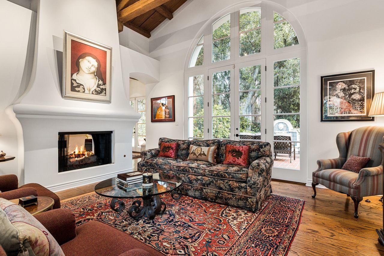 492 Monarch Lane Montecito, CA 93108 - Photo 6 of 58 a living room with furniture a large window and a fireplace