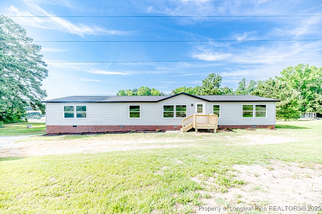 581 Thurlow Lake Road Carthage, NC 28327 - Photo 5 of 42 a view of a house with a yard