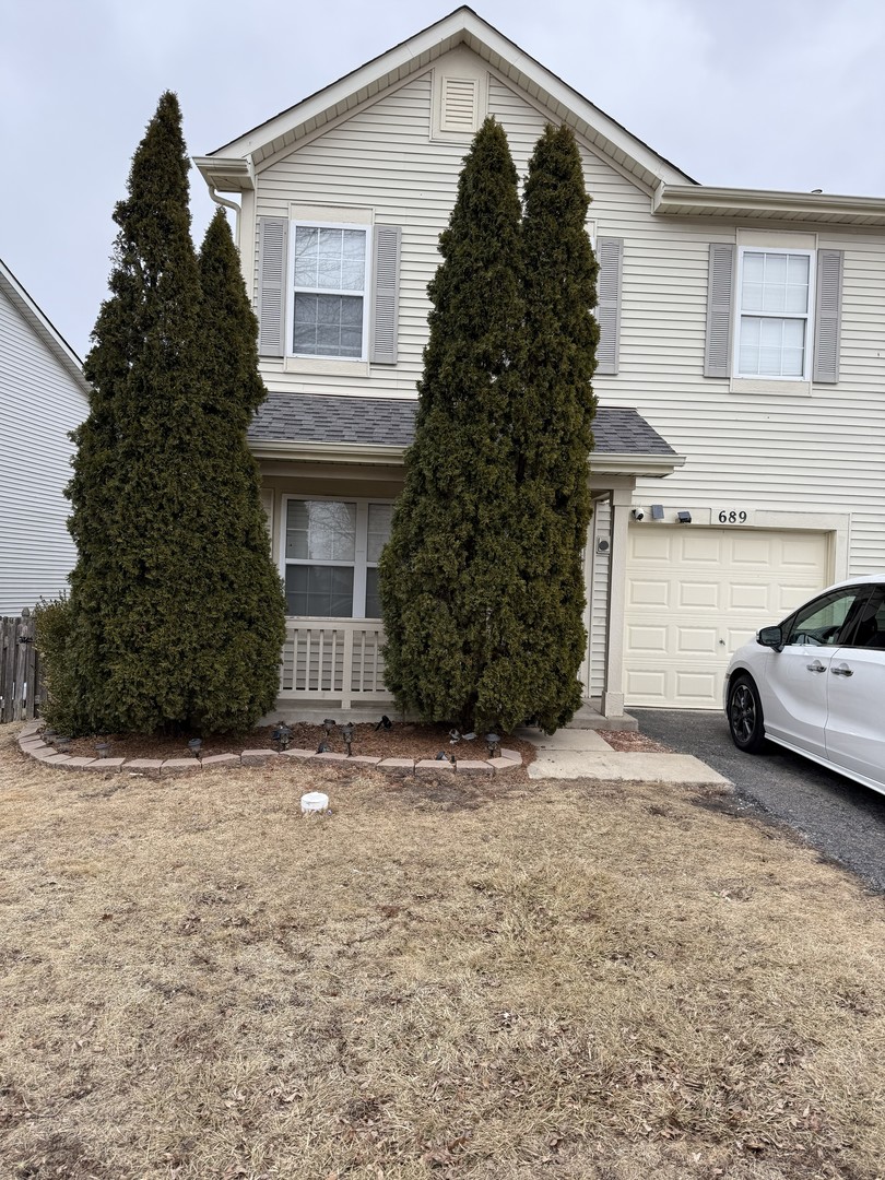 a car parked in front of white house