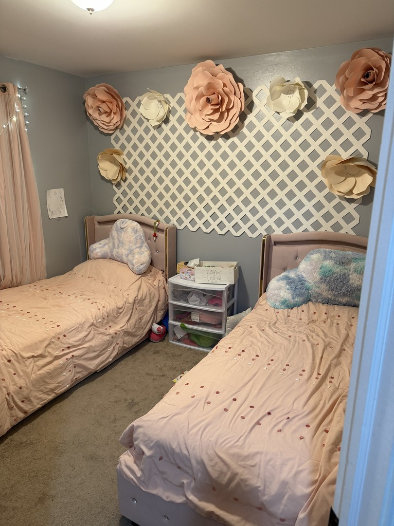 689 Shannon Drive Romeoville, IL 60446 - Photo 15 of 24 a bedroom with a bed and wall painting