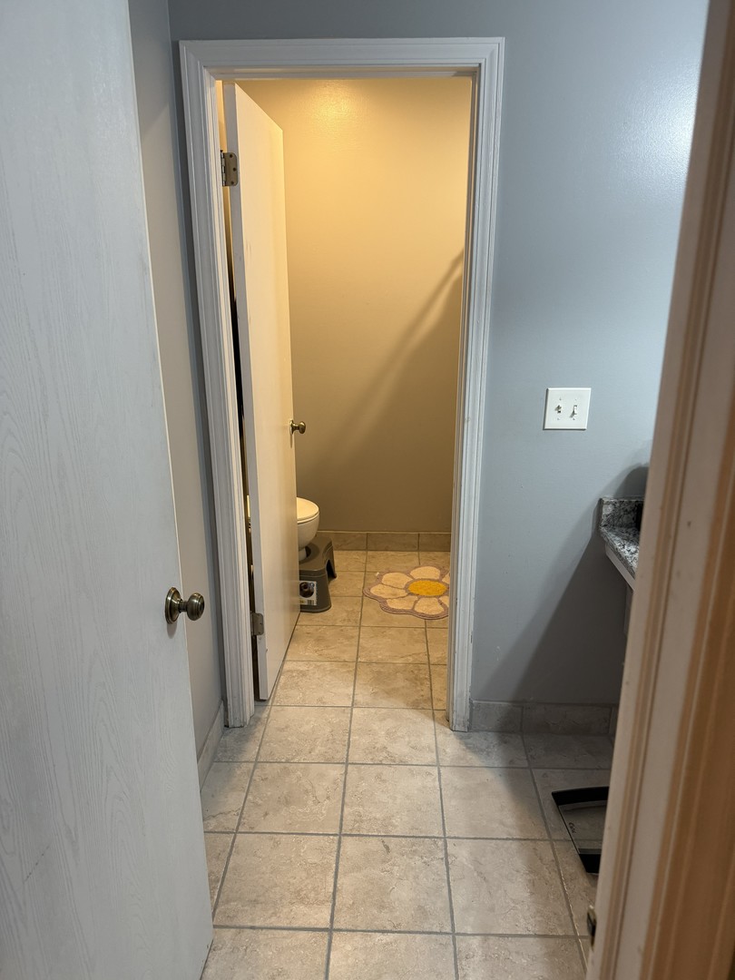 689 Shannon Drive Romeoville, IL 60446 - Photo 24 of 24 wooden floor in a bathroom next to a window