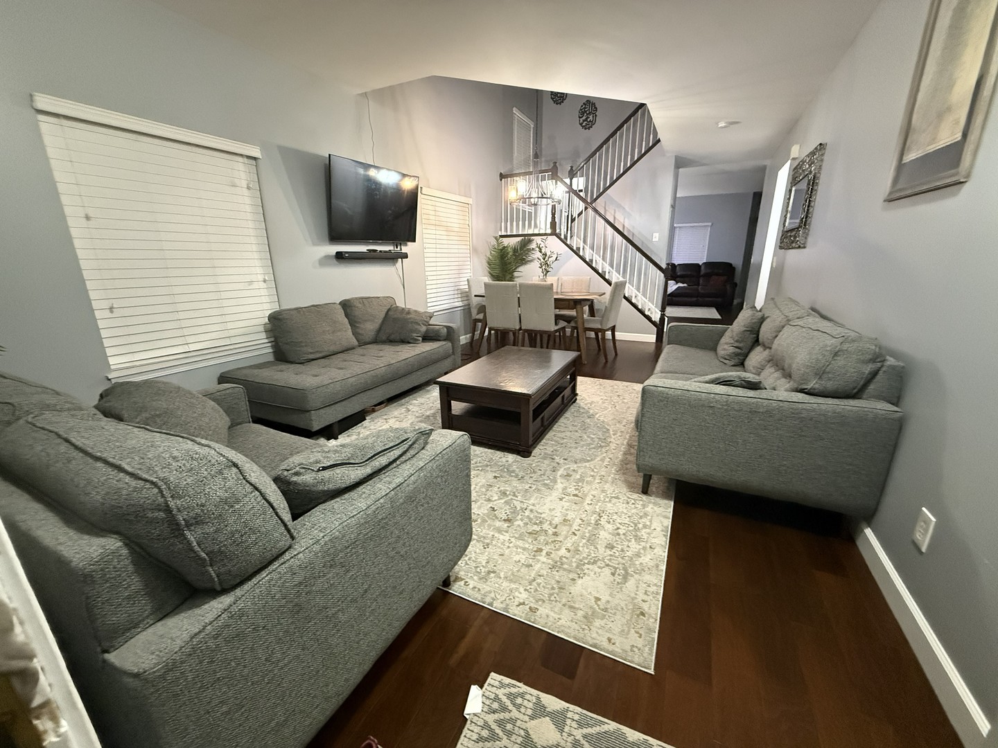689 Shannon Drive Romeoville, IL 60446 - Photo 4 of 24 a living room with furniture and a flat screen tv