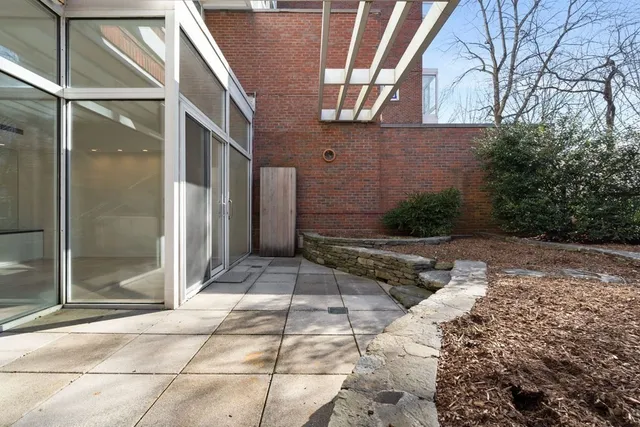 a kitchen with granite countertop white cabinets and sink
