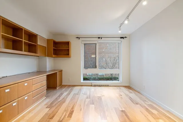 a spacious bathroom with a sink and a mirror