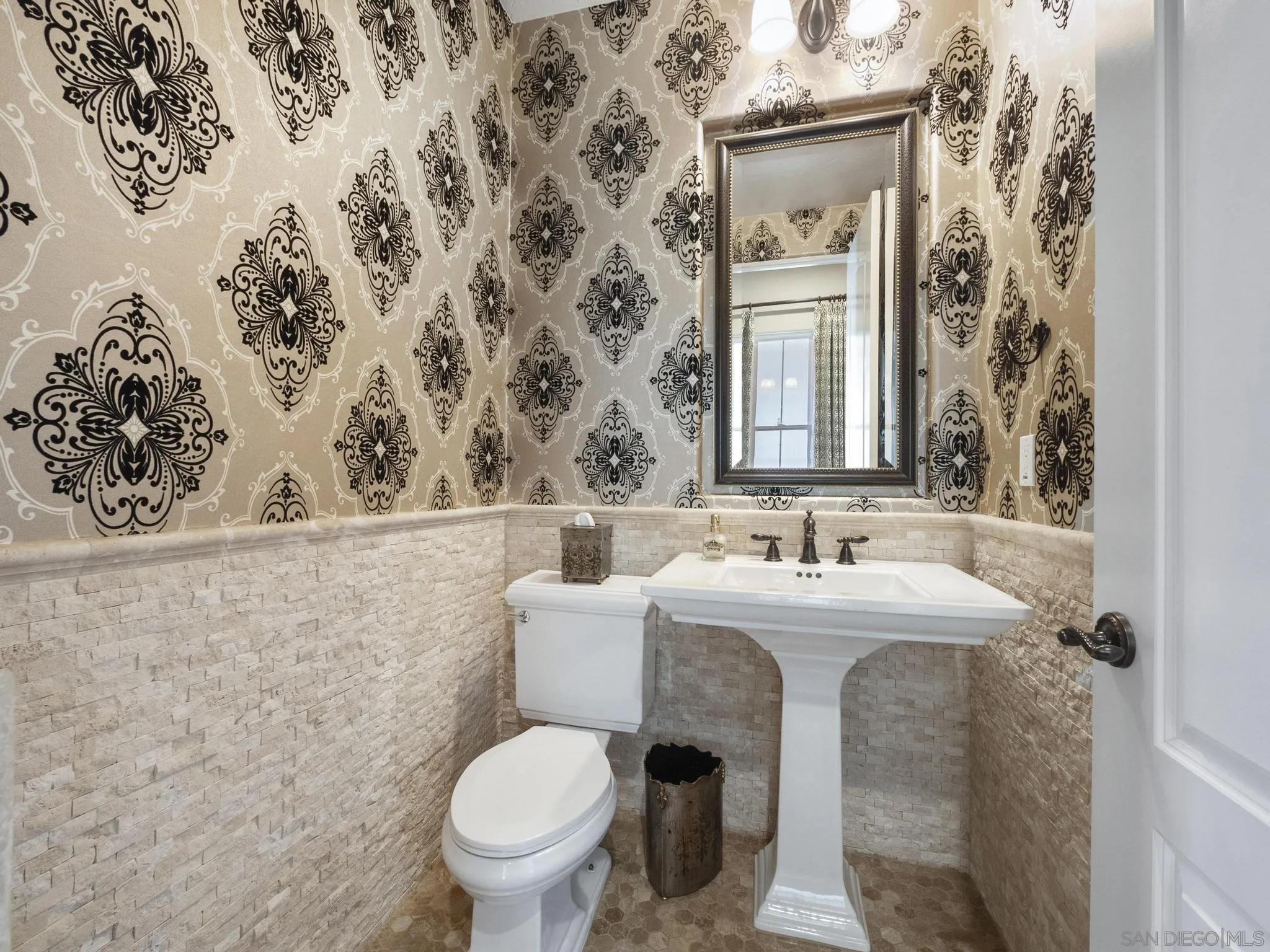 14636 Rio Rancho San Diego, CA 92127 - Photo 18 of 61 a bathroom with a toilet sink and mirror