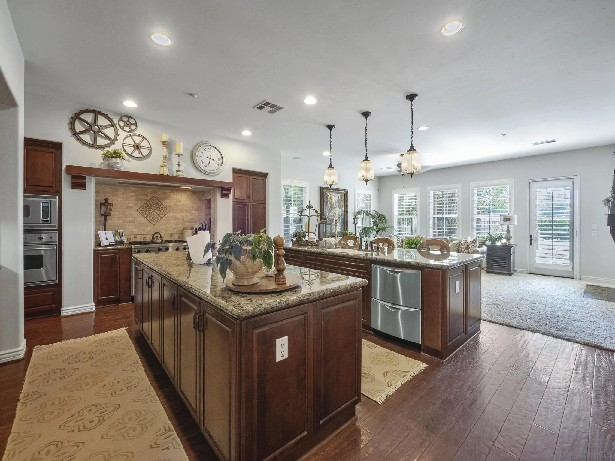 14636 Rio Rancho San Diego, CA 92127 - Photo 20 of 61 a kitchen with stainless steel appliances granite countertop a stove and a sink