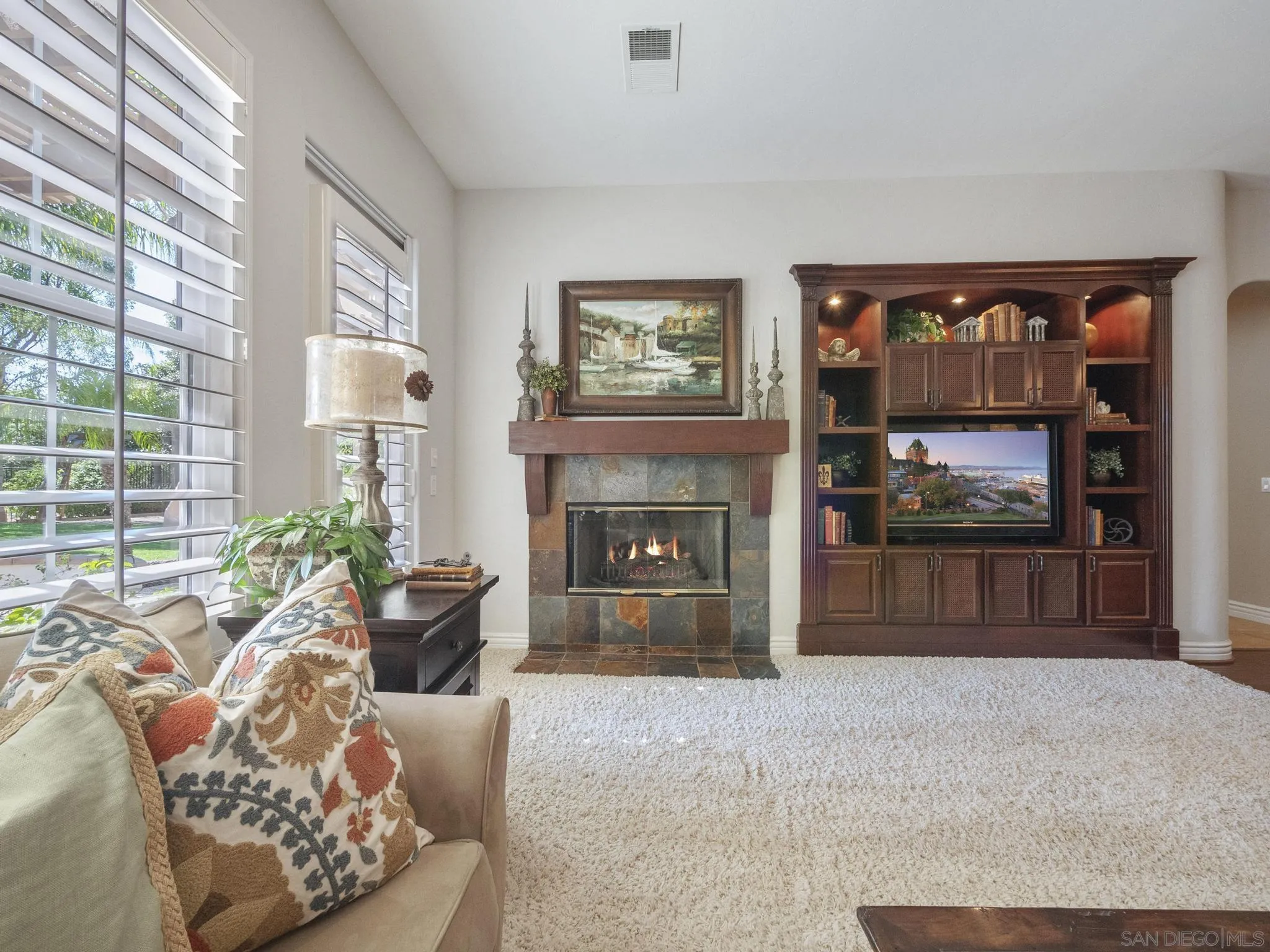 14636 Rio Rancho San Diego, CA 92127 - Photo 25 of 61 a living room with furniture a window and a fireplace
