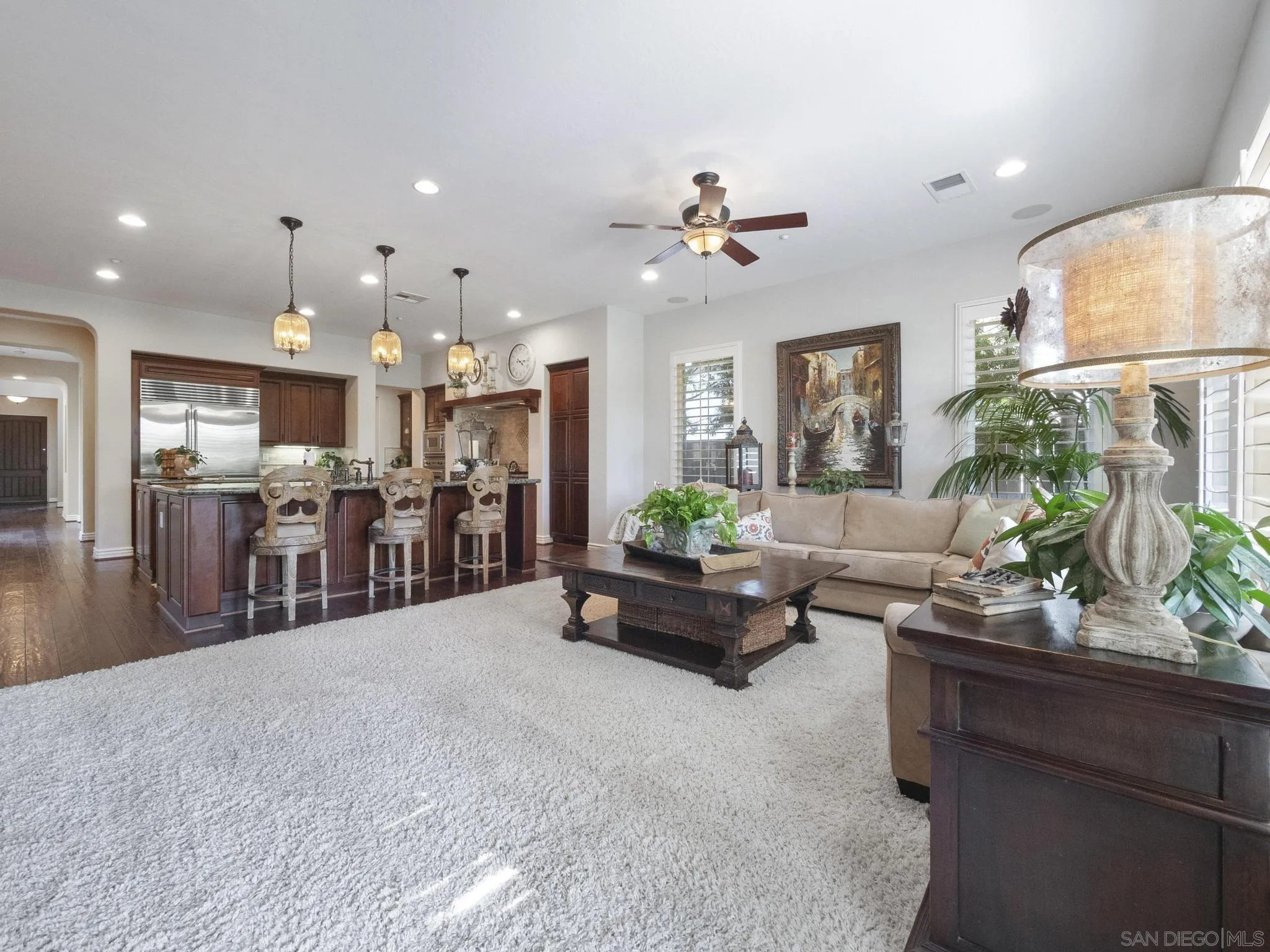 14636 Rio Rancho San Diego, CA 92127 - Photo 27 of 61 a living room with furniture and kitchen view