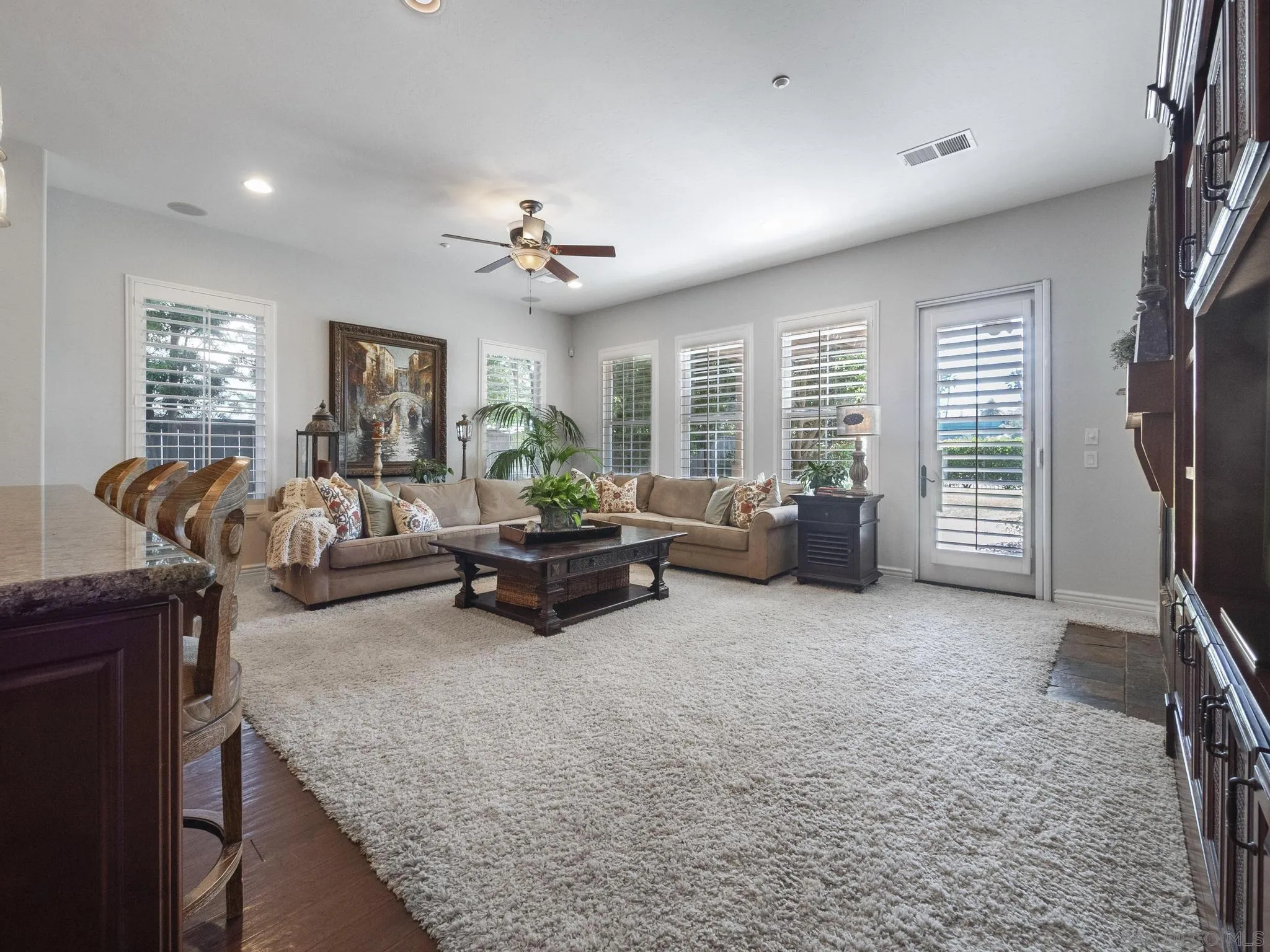 14636 Rio Rancho San Diego, CA 92127 - Photo 28 of 61 a living room with furniture and a flat screen tv